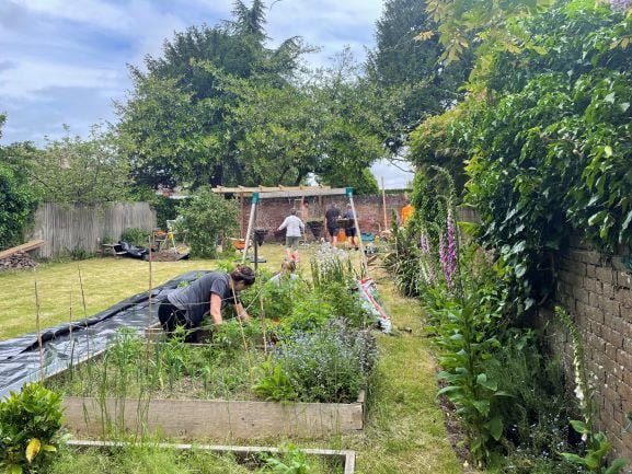 Weeding the Green Hub garden