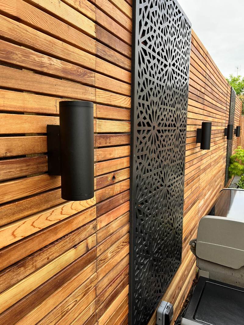 Red Cedar slats courtesy KLD Mistletoe Red Cedar garden fencing with lighting and decorative screen