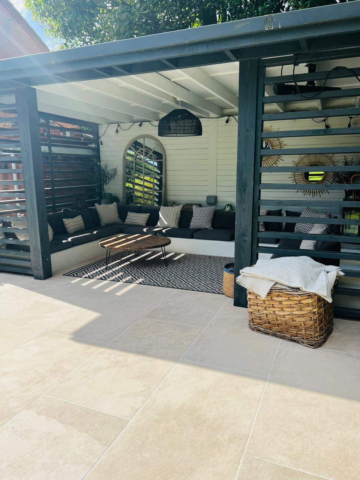 received_990361061640944 Sierra Cream porcelain paving with contemporary pergola