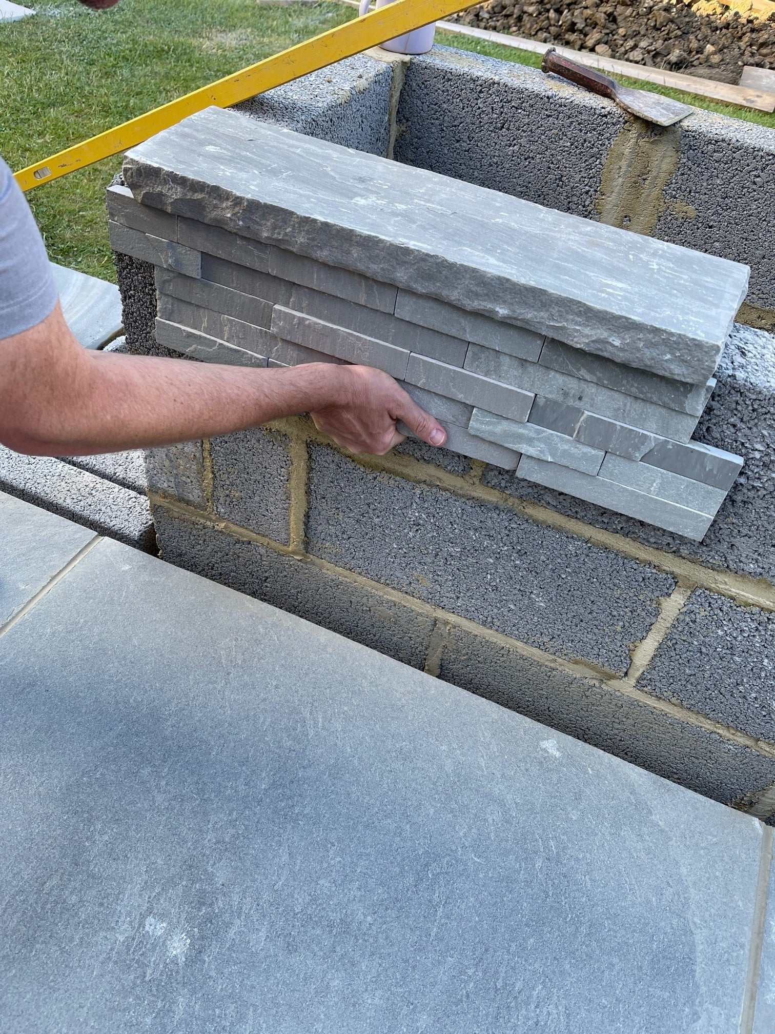 Adding porcelain cladding to concrete blockwork wall Adding porcelain cladding to concrete blockwork wall