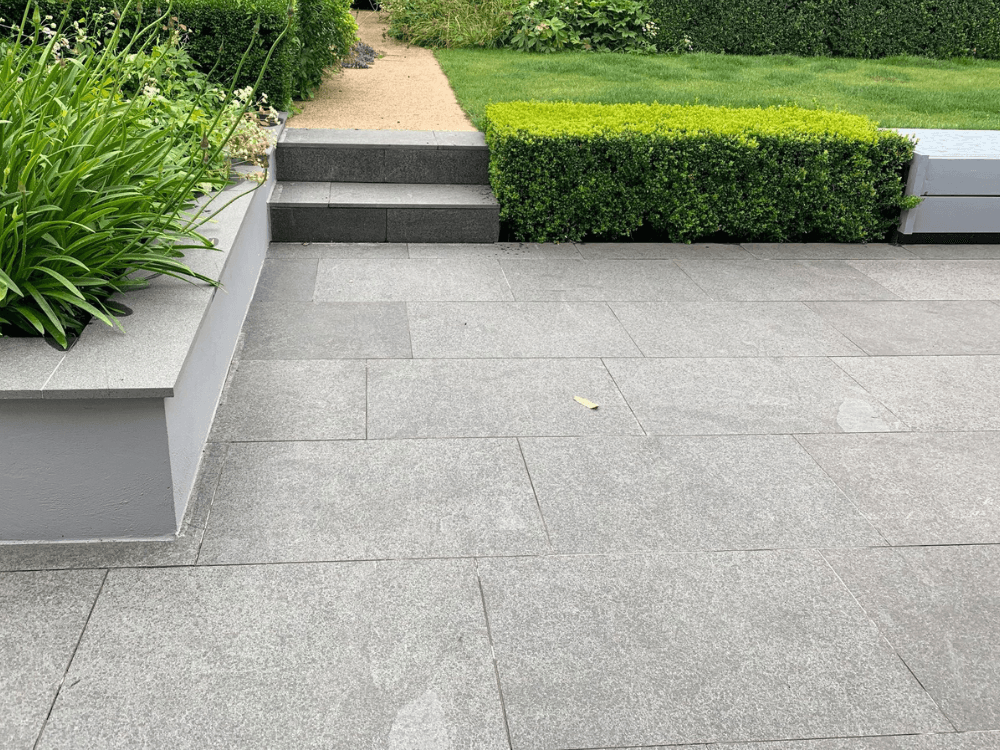 Granite’s durability, range of colours, and textures make it adaptable to various garden styles, from modern to rustic.
