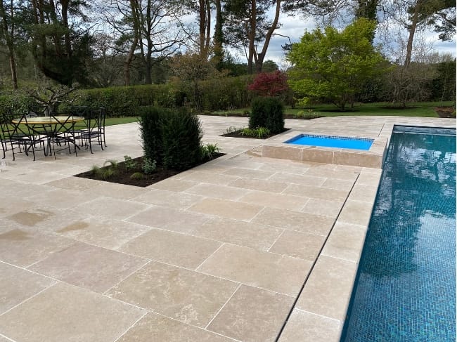 Egyptian Limestone patio with a pool
