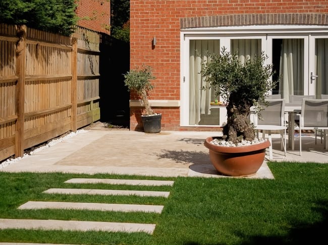 Mediterranean garden with limestone white porcelain paving