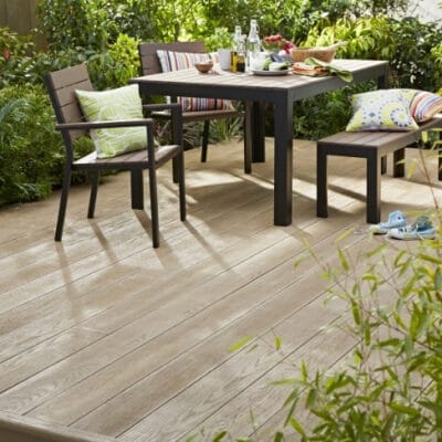 oak composite decking surrounded by plants