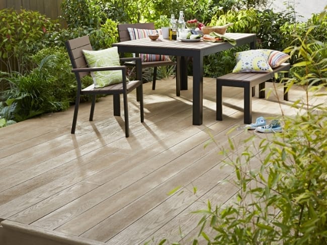 oak composite decking surrounded by plants