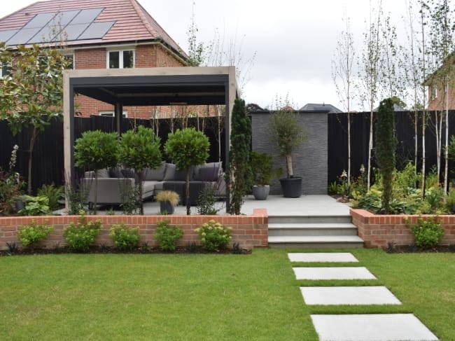 From sleek porcelain patios to natural stone pathways, your choice of garden style can completely transform how your outdoor space looks and feels. But when it comes to modern vs rustic garden design, which approach is right for you?
